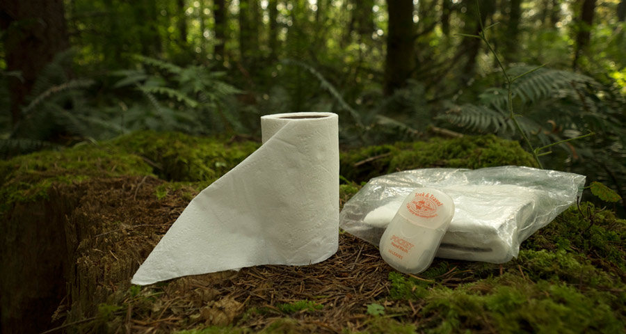 backcountry bathroom toolkit, including toilet paper and hand sanitizer