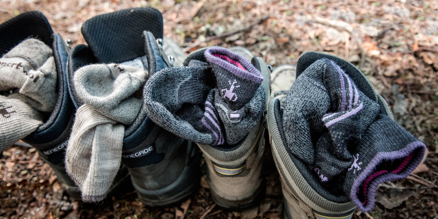 top down view of some hiking socks stuffed into the tops of hiking boots