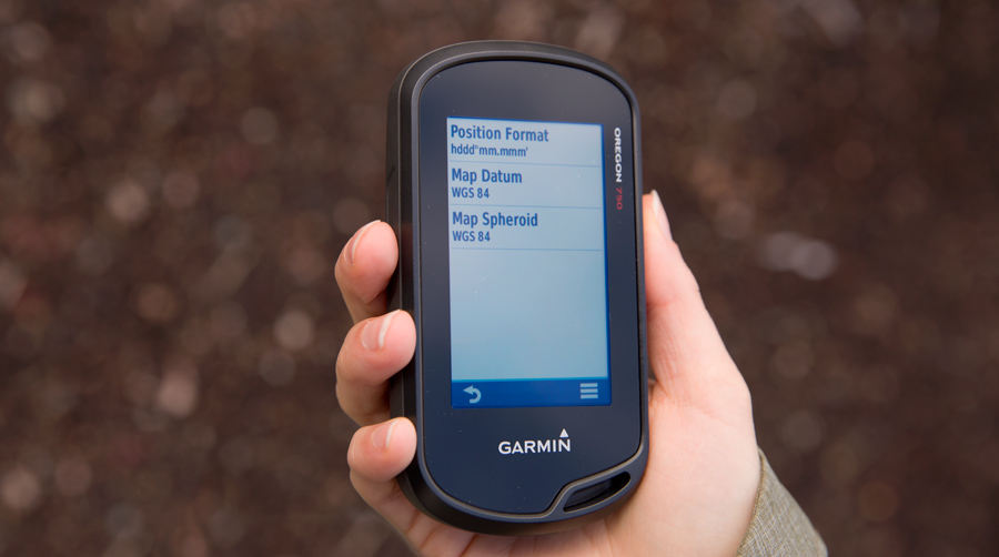 fitnessinf Expert Advice: How to Choose and Use a GPS - Setting Up Your GPS - handheld gps unit in hand, adjusting position format menu