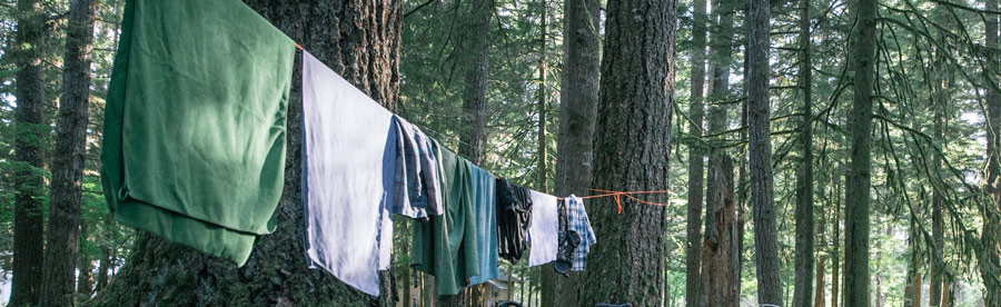 hanging clothes and towels to dry in a backcountry camp