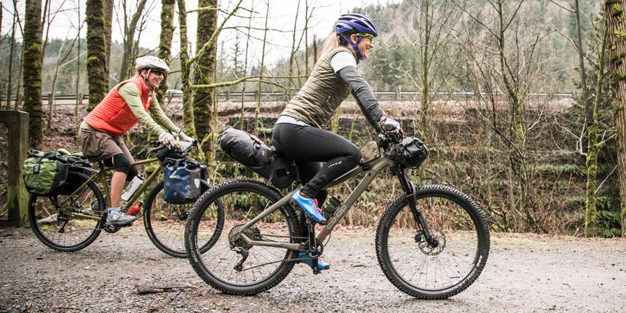 two happy bikepackers on the trail