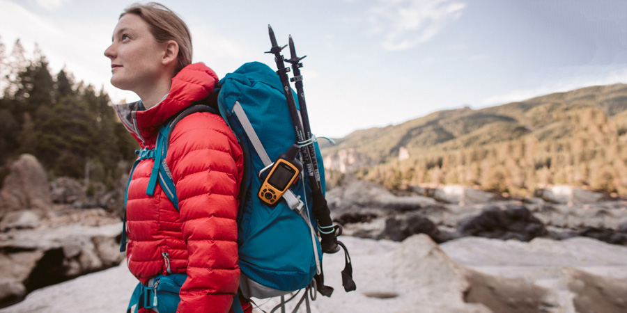 a backpacker using a daypack for an ultralight backpacking trip