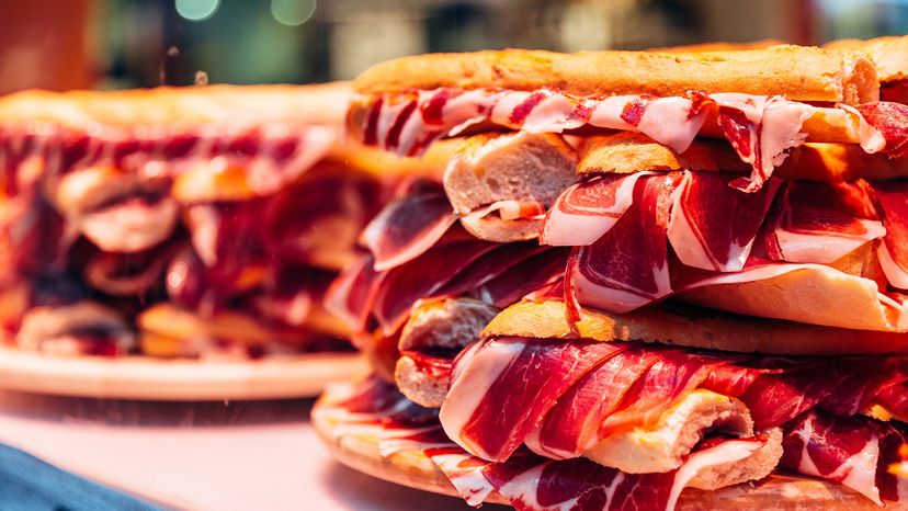 Big jamon ham sandwich on a display in a cafe, Valencia, Spain